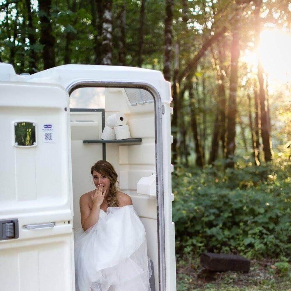 Bride in a porta potty